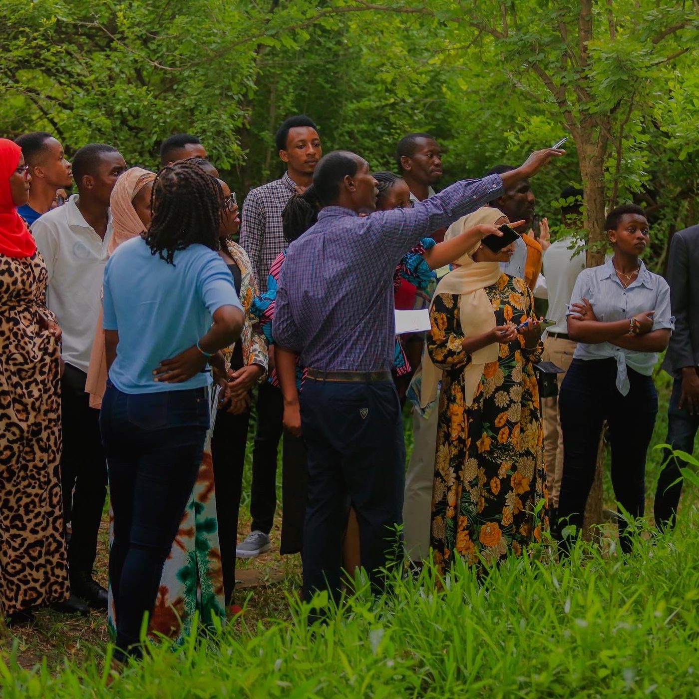 Pulse Network facilitator and community members during an outdoor field session